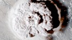 Massive submarine eruption darkened clouds half a world away